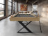 Billard Cross de la gamme Excellence en chene nature avec pieds noirs et tapis gris fonce dans un loft avec vue panoramique